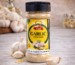 Garlic powder jar with fresh garlic cloves on wooden table kitchen background